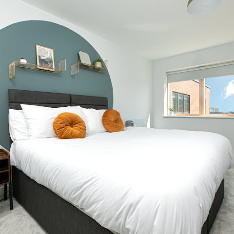 Sleep soundly in serene bedrooms, adorned with artwork, trinkets and plants