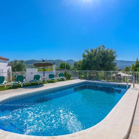 Admire the beautiful green landscape from the private pool