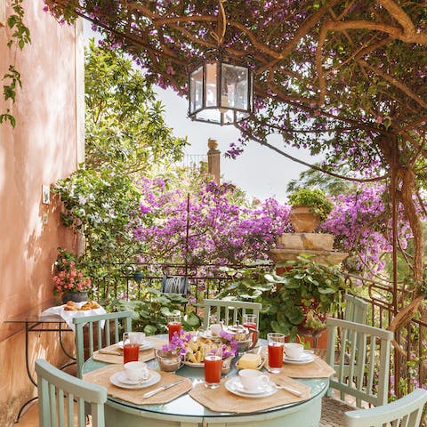 Tuck into an alfresco dinner underneath the enchanting foliage