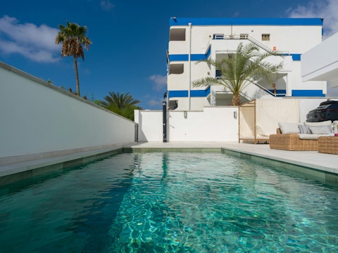 Cool off from the sun with a dip in the swimming pool