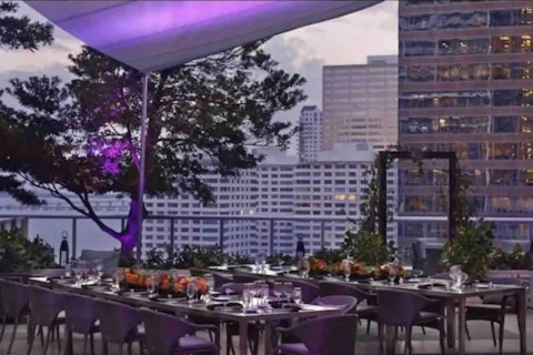 Dine alfresco as the Miami skyline lights up around you