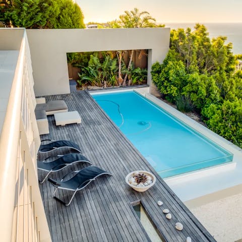 Cool off in the pool before curling up on a sun lounger with a book