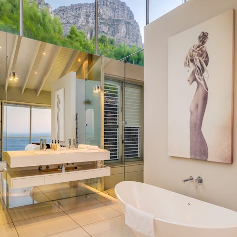 Run a bubble bath and soak up the view of the mountains and the sea