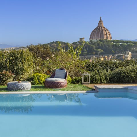 Stretch out by the pool with postcard views of St. Peter’s Dome