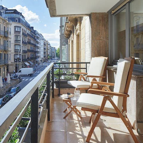 End the evening on the balcony, sipping a glass of Spanish vino and watching the hustle and bustle below