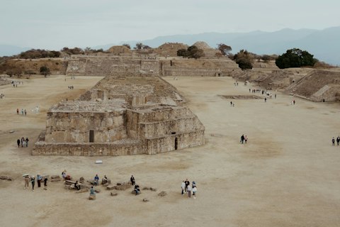 Stand atop Monte Albán's ancient pyramids overlooking sacred mountain valleys
