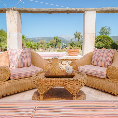 Pour a glass of your favourite tipple and watch the sun set behind the hills