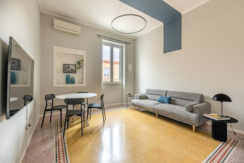 Gather in a space where original terrazzo floors meet contemporary design