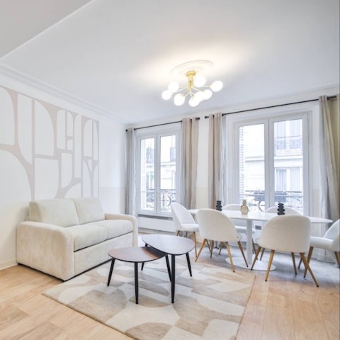 Gather in a light-filled living room with classic Haussmann details