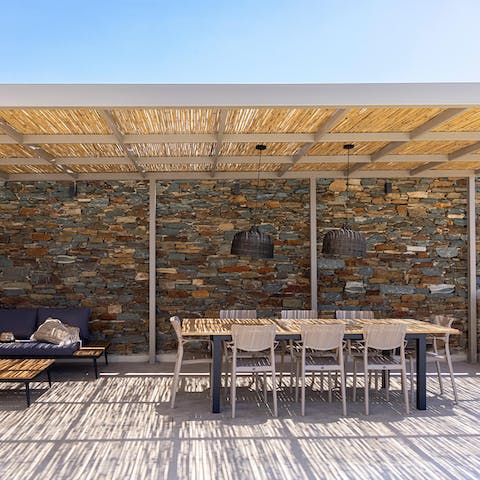 Dine alfresco in the shade of the terrace and look out across the sea
