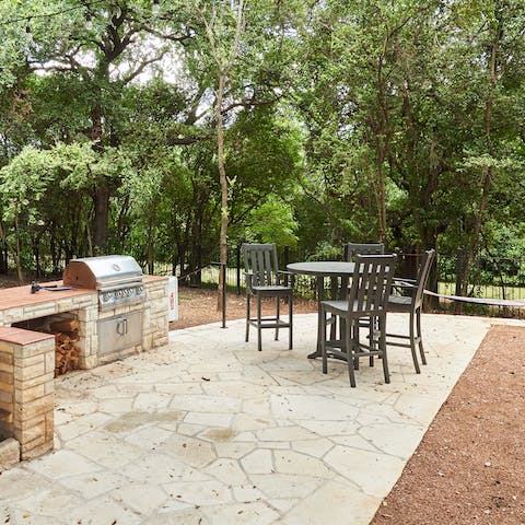 Enjoy an alfresco barbecue feast beneath the shade of the trees in the communal courtyard