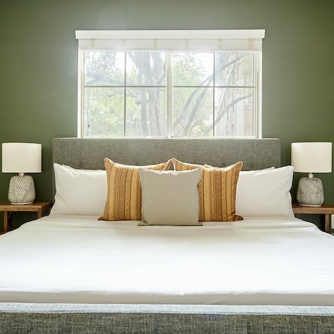 Wake up in your calm green bedroom feeling rested and ready for another day of exploring