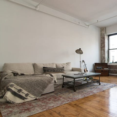 Start your day with a hot cup of coffee on the soft sofa