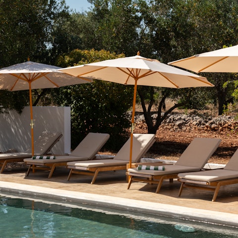 Soak up the Italian sunshine while lounging by the pool