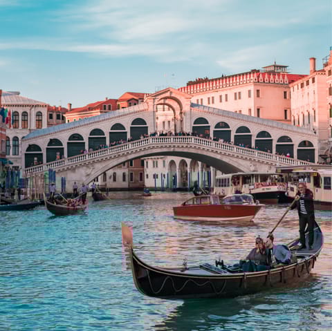 Stroll to Rialto Bridge with a gelato