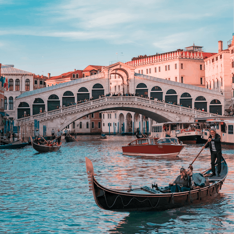 Stroll to Rialto Bridge with a gelato
