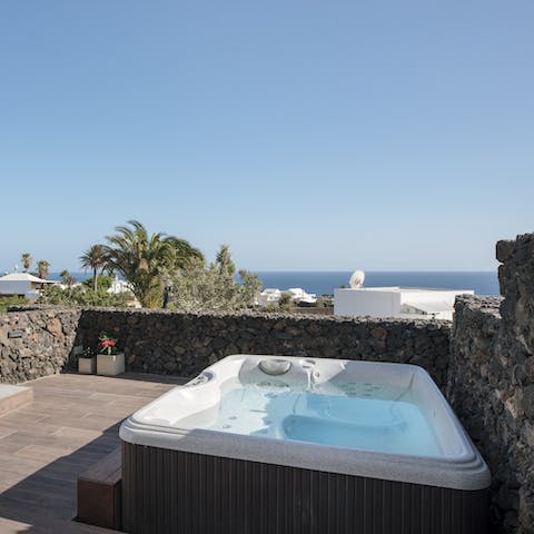 Soak under the starry night sky in the bubbling hot tub