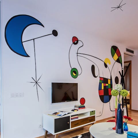 Admire the unique, quirky murals in the modern living space