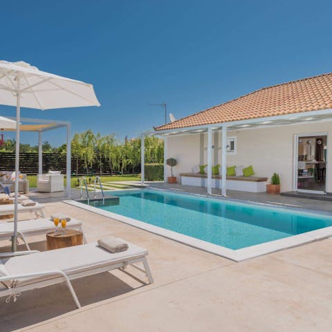 Have your pick of outdoor seating when coming out of the private pool
