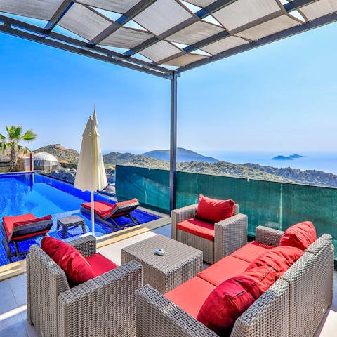Sip a sundowner on the partially covered terrace