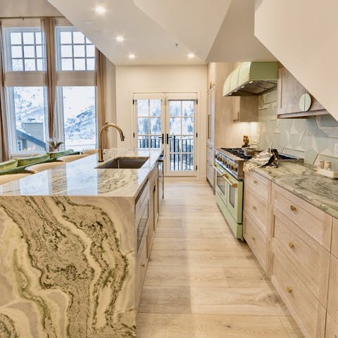 Make mealtimes special by preparing food together in the sleek kitchen