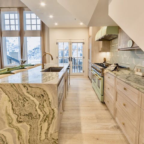 Make mealtimes special by preparing food together in the sleek kitchen