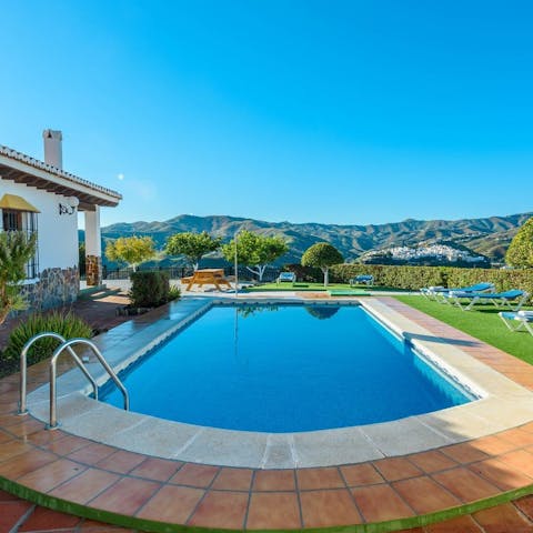 Take in breathtaking mountain views from the poolside patio
