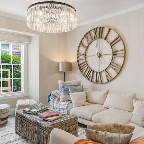 Find a cosy spot to read by the fire in the living room