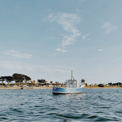 Spend the day at Sandbanks Beach, a thirteen-minute drive away
