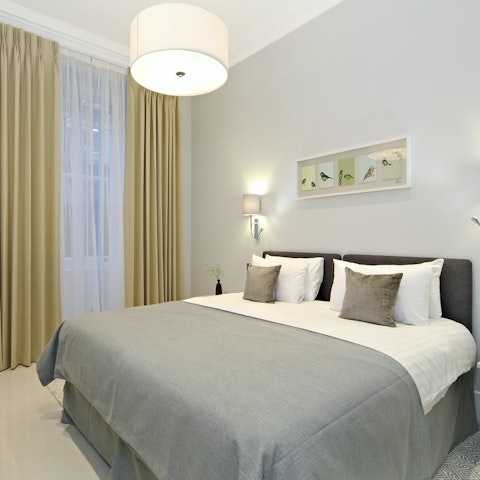 Enjoy a restful night's sleep in the contemporary bedroom