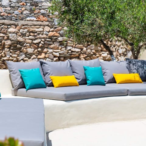 Sprawl out on the outdoor sofa with a glass of wine and a good book