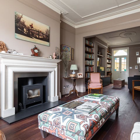 Unwind in the living room in front the fire after a long day exploring the city