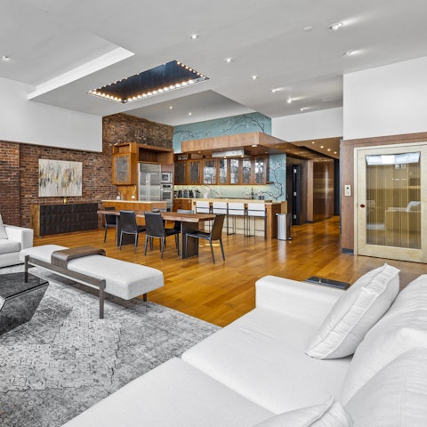 Arrive by private elevator into a soaring, open-plan living space