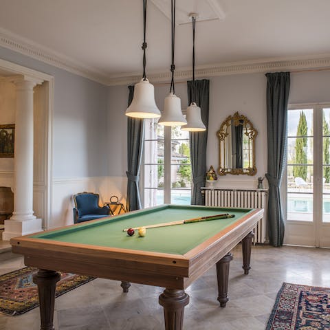 Try and beat a family member in a game of French billiards