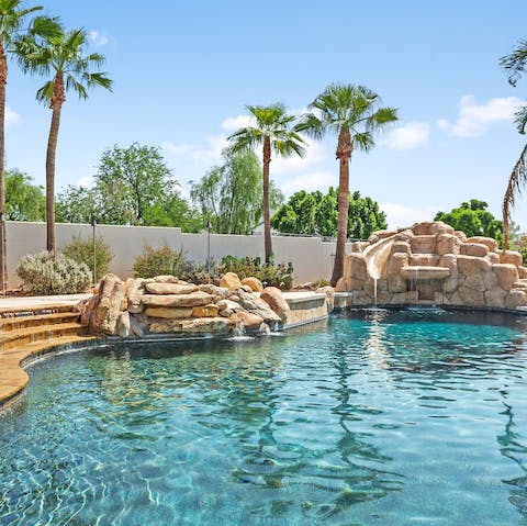 Cool off from the Arizona sunshine in the waterfall swimming pool