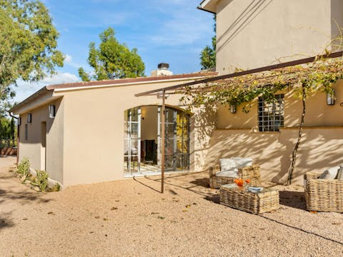 Sip lemonade in the shade of the vine-covered pergola