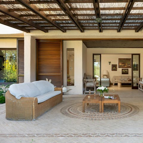Kick back on the covered terrace with a good book and your morning coffee