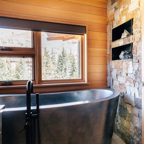 Soak in the sleek freestanding bathtub