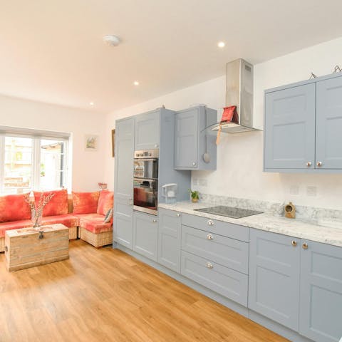 Prepare scones with cream and jam in the pretty kitchen