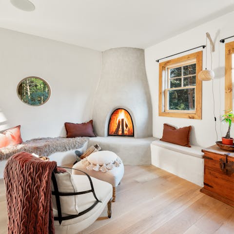 Spend cosy evenings relaxing by the fire in the living room