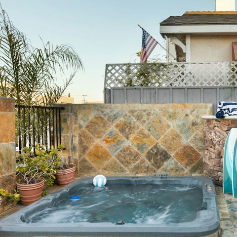 Unwind in the hot tub after a day spent exploring the coast