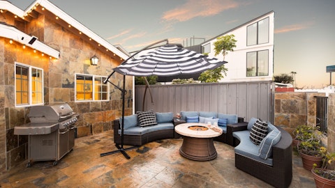 Gather around the firepit to toast your trip with alfresco drinks