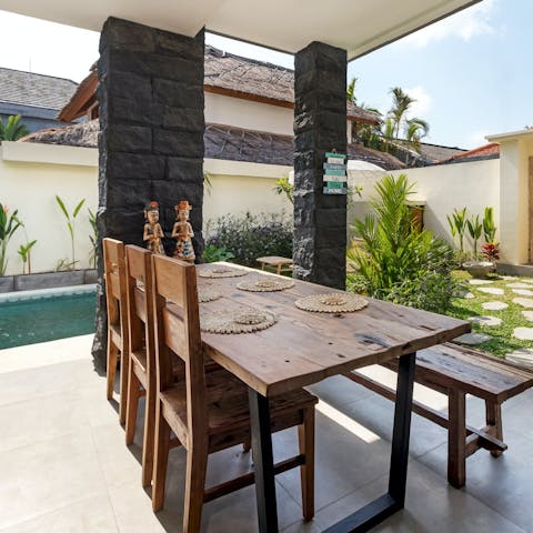 Feast on Indonesian food on the shaded terrace