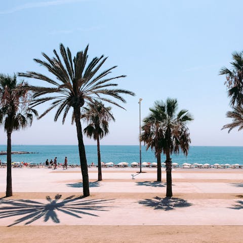Spend sunny days on Barceloneta Beach, only minutes away on foot