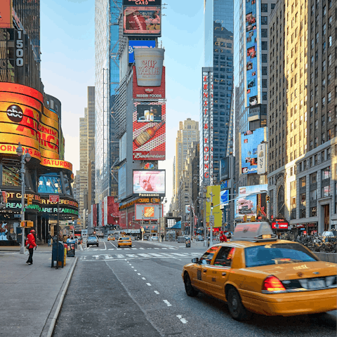 Walk along Broadway to pay a visit to Times Square