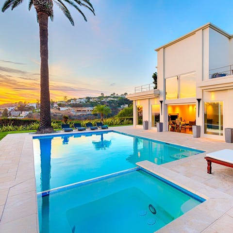 Soak in the Jacuzzi as you watch the sky turn to orange