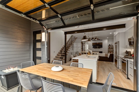 Fold back the glass door and dine between inside and out
