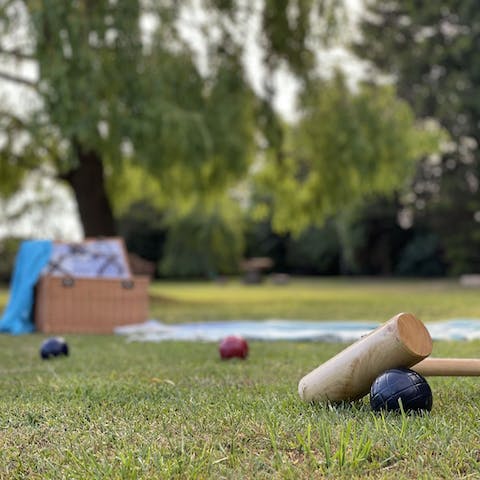While away the afternoon with a game of croquet on the lawn