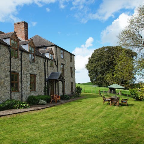 Sip a cool drink on the beautifully-kept lawn