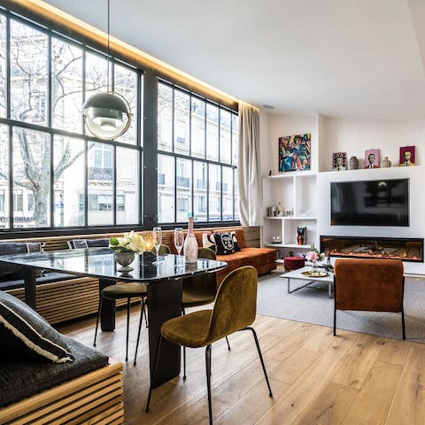 Relax in a bright open-plan living space, with slick crittall windows spanning the length of the room